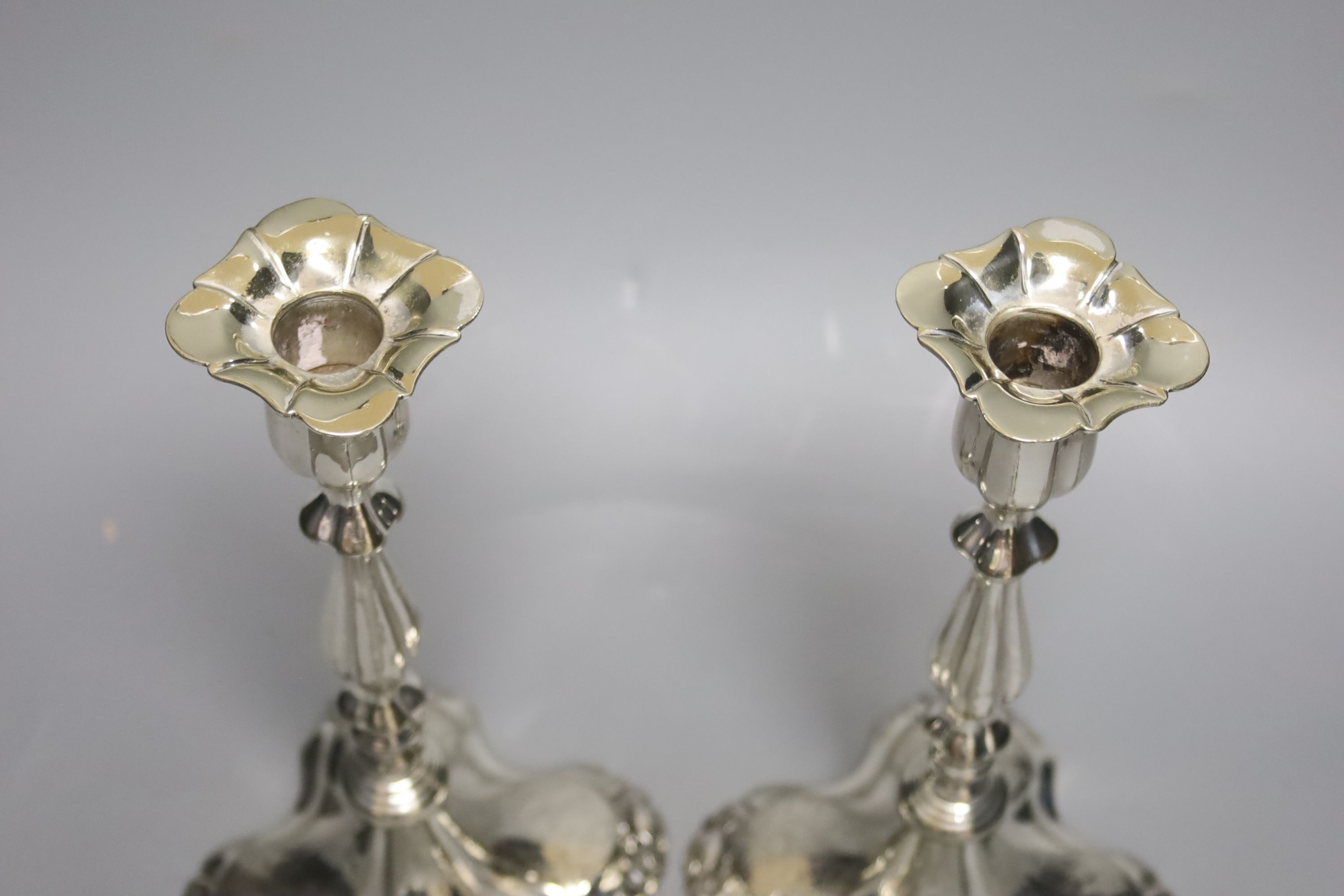 A pair of plated candlesticks, height 26cm